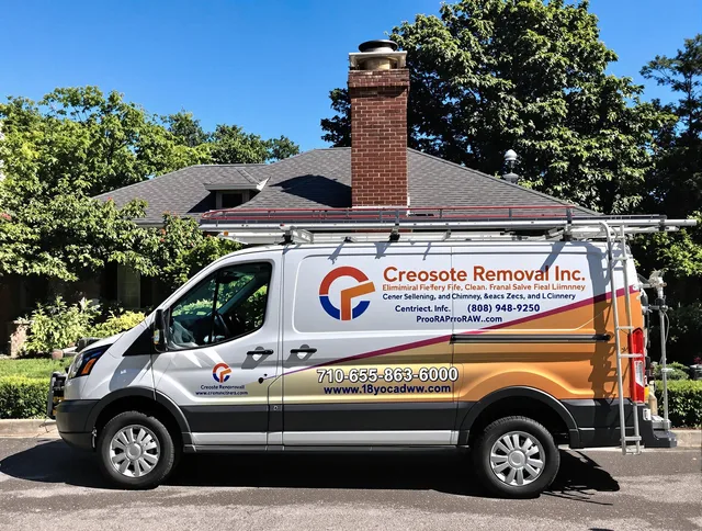 Cuyahoga Falls Chimney Sweep technician removing creosote safely in Cuyahoga Falls, OH