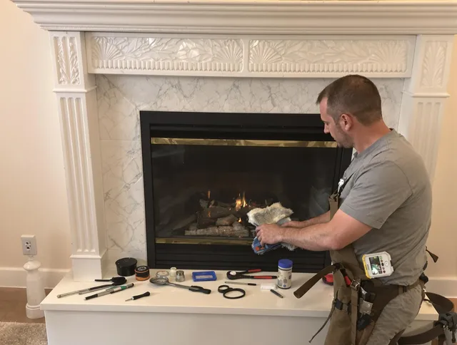 Cuyahoga Falls Chimney Sweep performing fireplace maintenance in Cuyahoga Falls, OH